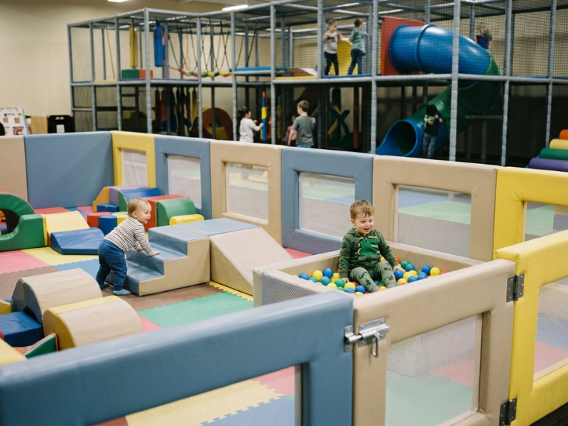 Gated toddler zone with low soft play equipment Gated toddler zone with low soft play equipment