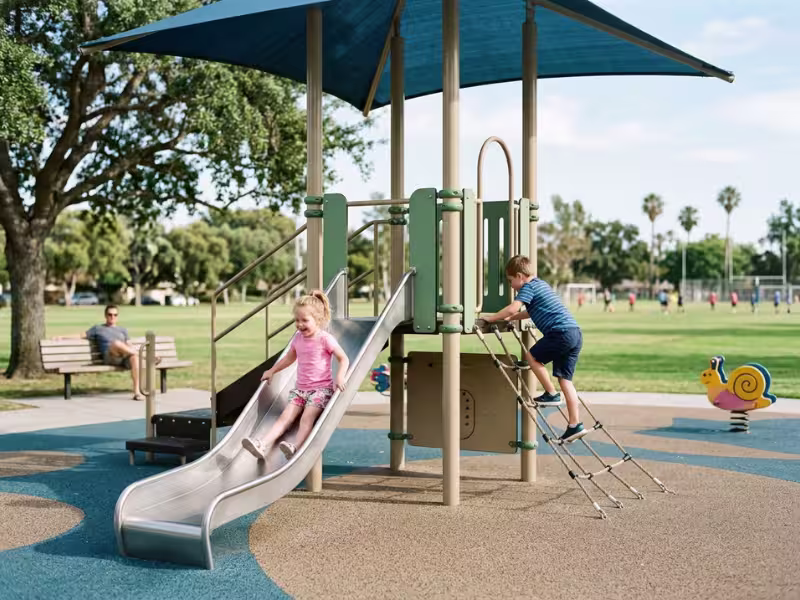 Kids playing on outdoor playground equipment Kids playing on outdoor playground equipment